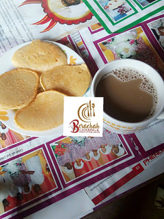 A picture of Pan cakes and chocolate cold drink.