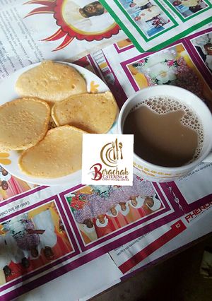 A picture of Pan cakes and chocolate cold drink.