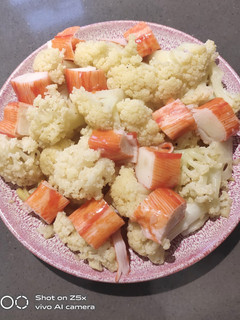 A picture of Cauliflower Sauteed with Crab Stick.