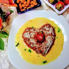 A picture of Strawberries and carrot in poppy seeds pudding.