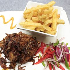 Deep fried marinated pork with fries A picture of Deep fried marinated pork with fries.