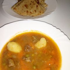 A picture of Green peas stew with chapati.
