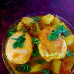 A picture of Egg spicy potato curry.