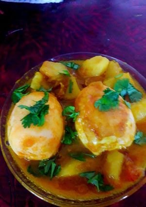 A picture of Egg spicy potato curry.