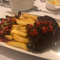 A picture of Steak, chips & roast veg.