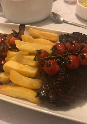 A picture of Steak, chips & roast veg.