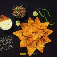 Homemade Doritos Chips With Cheese Sauce & Salsa A picture of Homemade Doritos Chips With Cheese Sauce & Salsa.