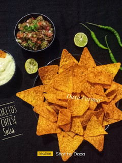 A picture of Homemade Doritos Chips With Cheese Sauce & Salsa.