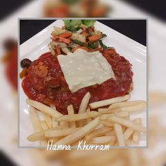 A picture of Grilled Beef steak with Mexican sauce.