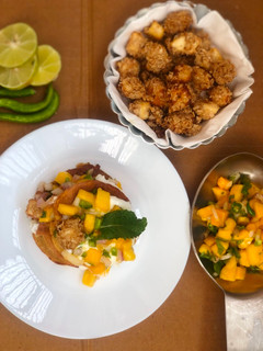 A picture of Pancakes with oats crusted paneer and mango salsa.