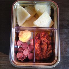 A picture of Yam, tomato sauce, sausage and chicken breast.