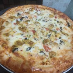 Chicken tikka pizza A picture of Chicken tikka pizza.