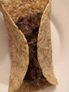 Una foto de Caraotas o frijoles negros refritos