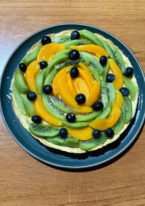 Una foto de Tarta Frutal 🥝🫐🍑