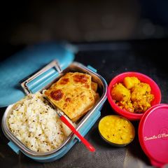 A picture of Lunch box (Jeera rice,ajwain paratha, pili dal, gobhi aloo sabzi.