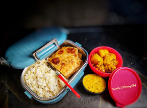 A picture of Lunch box (Jeera rice,ajwain paratha, pili dal, gobhi aloo sabzi.