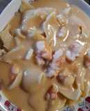 Lumaconi rellenos de ragú de setas y velouté de marisco