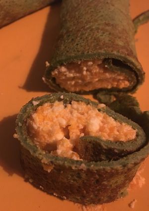 Una foto de Canelones de masa de espinaca y rellenos de calabaza y ricota