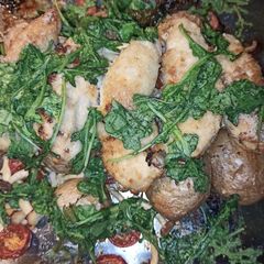 A picture of Roasted Red Potatoes and Chicken Breast.