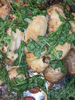A picture of Roasted Red Potatoes and Chicken Breast.