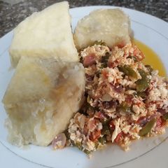A picture of Boiled yam with egg sauce.