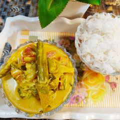 A picture of Avial curry with rice.