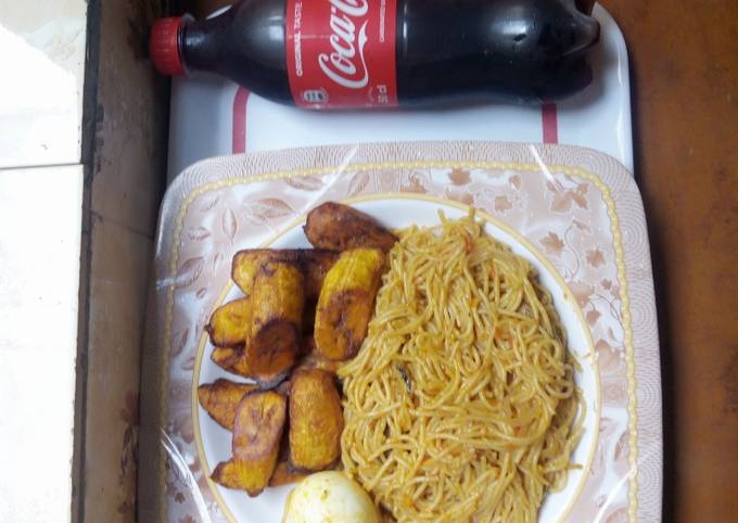 Jollof pasta and fried plantain with boiled egg