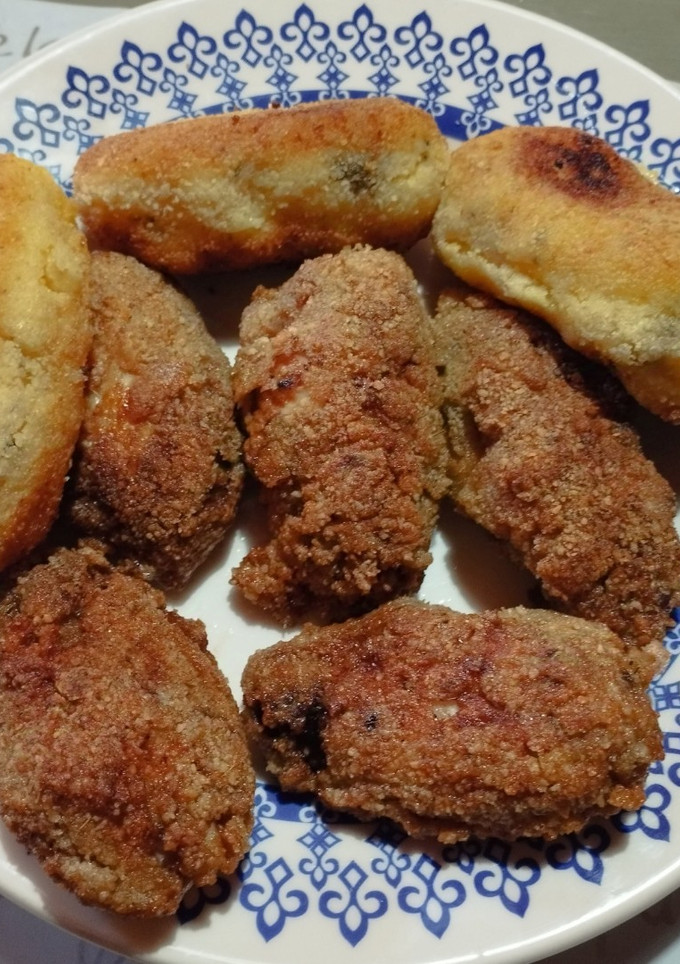 Una foto de Alitas con cajún y bombas de polenta rellenas