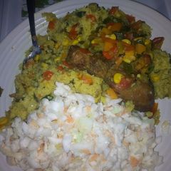 A picture of Stirfry Vegetable with couscous, coselaw& fried chicken.