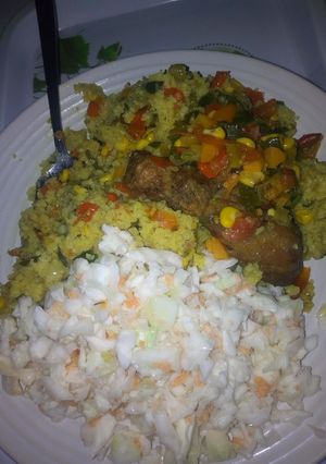 A picture of Stirfry Vegetable with couscous, coselaw& fried chicken.