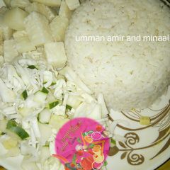 A picture of White rice, yam and cabbage with cucumber.