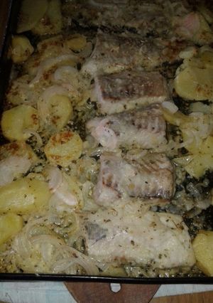 Una foto de Filet de merluza con papas a la crema