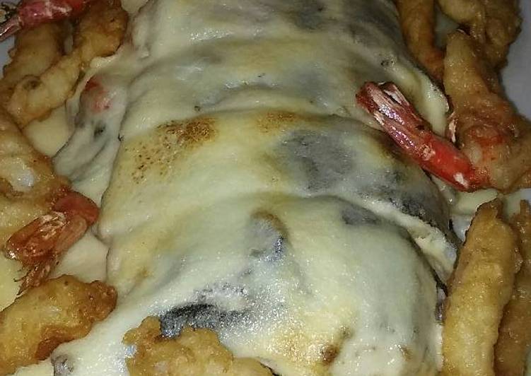 Merluza rellena de espinacas, gambas y piñones