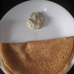 A picture of Wheat flour dosa with chutney.