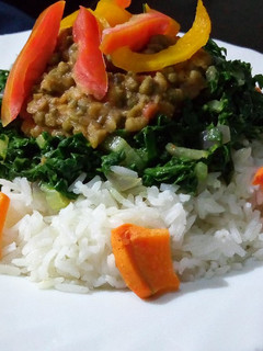 A picture of Rice with ndengu and buttered spinach.