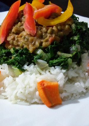 A picture of Rice with ndengu and buttered spinach.