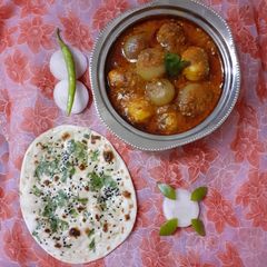 A picture of Stuffed onion potato sabzi.