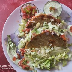 A picture of Tangy Mexican tacos with hung Curd dip.