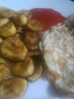 A picture of Shallow fried Plantain and eggs.