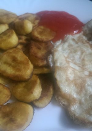 A picture of Shallow fried Plantain and eggs.