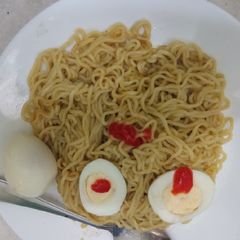 A picture of Indomie with boiled eggs.