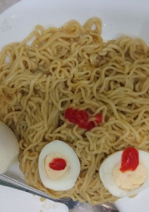 A picture of Indomie with boiled eggs.