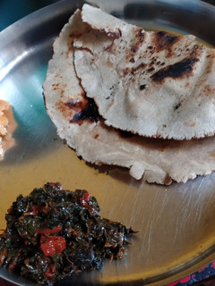 A picture of Jowar Roti with Vegetables and Jaggery.