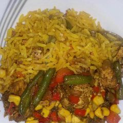 A picture of Chinese fried rice with mixed sauce.