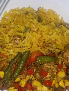A picture of Chinese fried rice with mixed sauce.