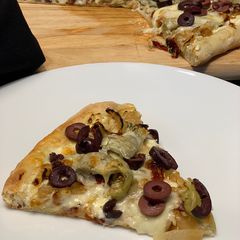 A picture of Artichoke, Sun-dried Tomato, and Goat Cheese Pizza.