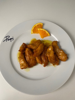 Una foto de Pollo a la naranja 🍊