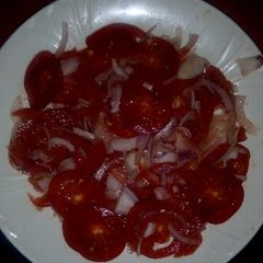 A picture of Onion tomato salad.