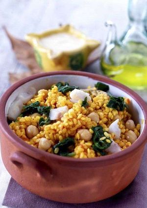 A picture of Rice casserole with spinach, chickpeas and cod.