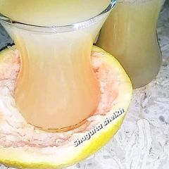 A picture of Fresh and healthy grapefruit juice.